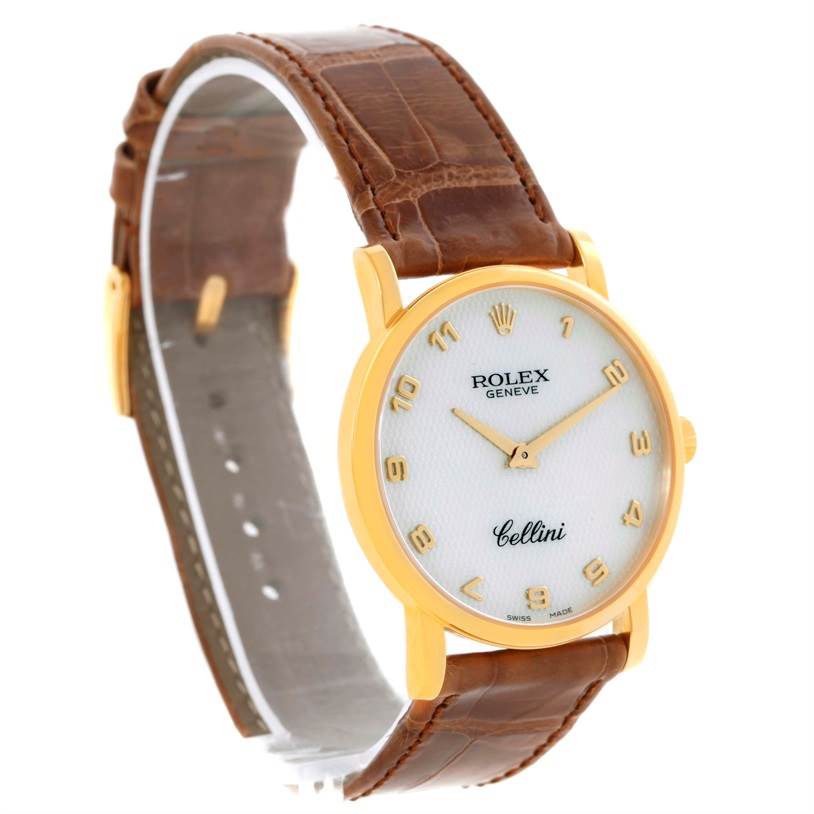 The image shows a Rolex Cellini 5115 Men
s Yellow Gold Mother of Pearl Dial 5115 Men
s Yellow Gold Mother of Pearl Dial watch at an angled view, highlighting its dial, case, and brown leather strap.