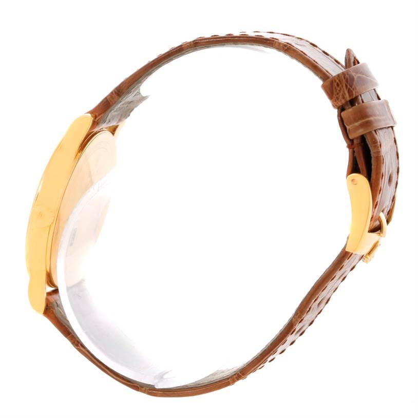 This side angle view of the Rolex Cellini 5115 Men
s Yellow Gold Mother of Pearl Dial 5115 Men
s Yellow Gold Mother of Pearl Dial model shows the watch
s case and the brown leather strap with buckle.