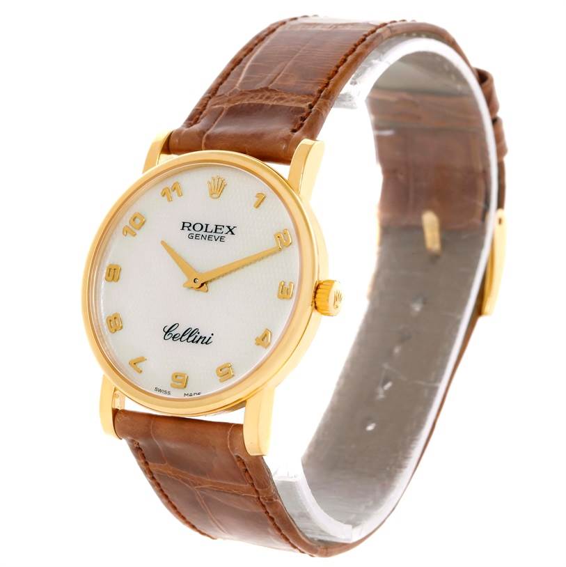 This image shows a Rolex Cellini 5115 Men
s Yellow Gold Mother of Pearl Dial 5115 Men
s Yellow Gold Mother of Pearl Dial watch at a slight angle, highlighting its gold case, white dial, and brown leather strap.