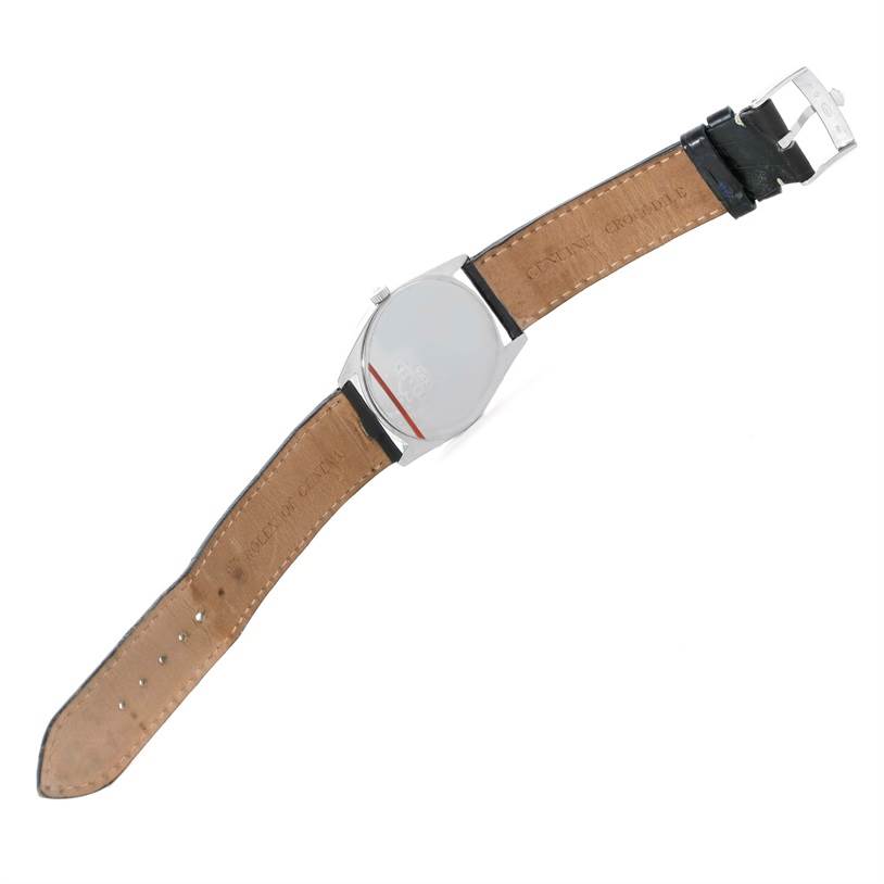 The image shows the back view of a Rolex Cellini 4233 Men
s White Gold White Dial 4233 Men
s White Gold White Dial watch, highlighting its leather strap and clasp.