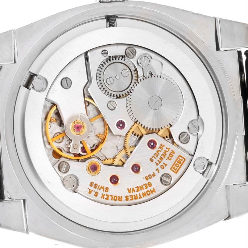 The image shows the internal mechanics of the Rolex Cellini 5320 Men's White Gold Mother of Pearl Dial 5320 Men's White Gold Mother of Pearl Dial watch from a back view, showcasing its gears and movement.