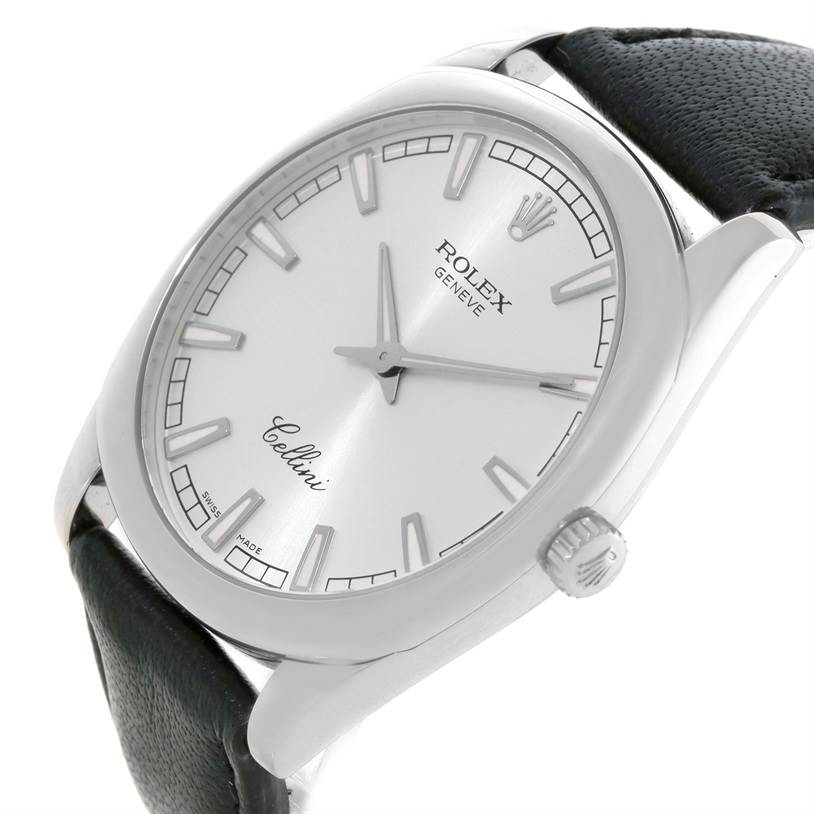 The Cellini model by Rolex is shown at an angled view, displaying the face, crown, and part of the black leather strap.