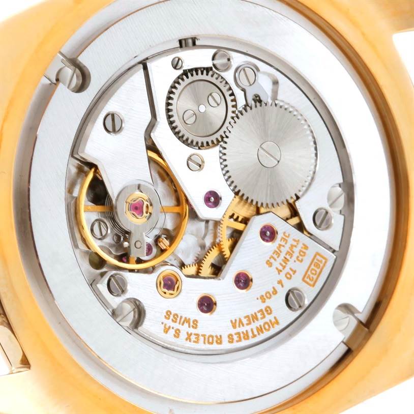 This image shows the intricate internal movement and gears of a Rolex Cellini 4233 Men's Yellow Gold White Dial 4233 Men's Yellow Gold White Dial watch from a close-up, rear view angle.