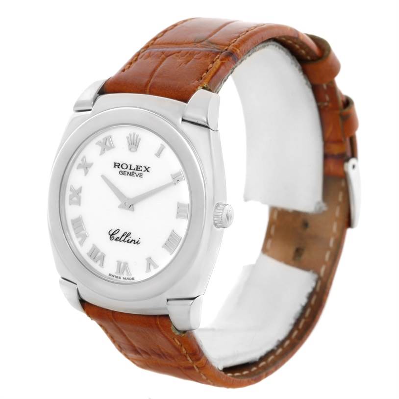 The image shows a Rolex Cellini 5330 Men
s White Gold White Dial 5330 Men
s White Gold White Dial watch taken at a slightly angled side view, showcasing the face, crown, and leather strap.