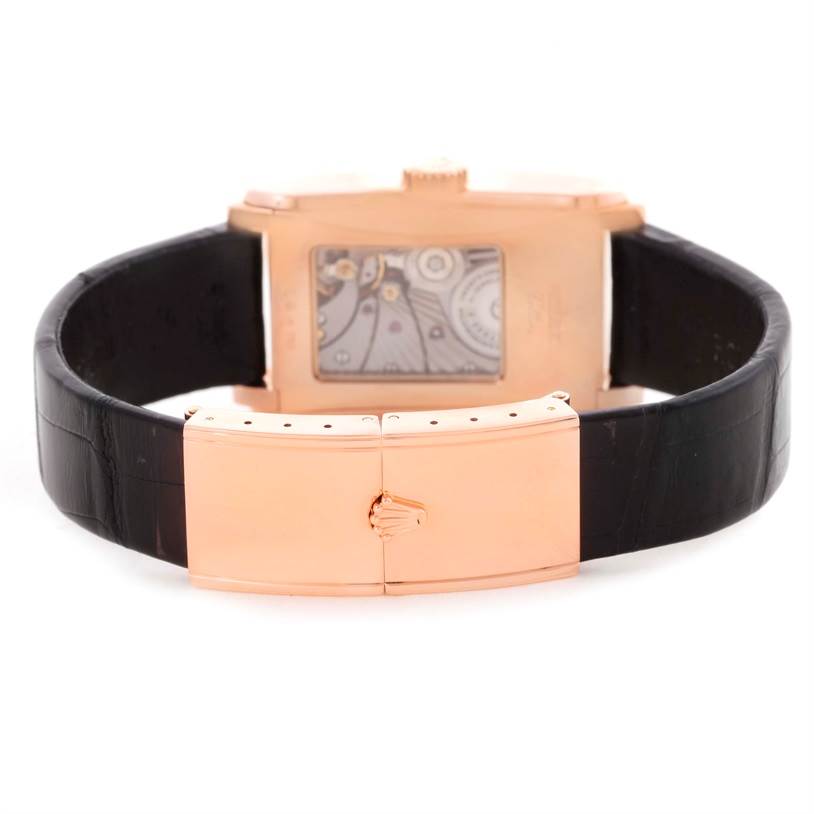 The image shows the back view of a Rolex Cellini 5442.5 Men's Rose Gold Black Dial 5442.5 Men's Rose Gold Black Dial watch, highlighting its clasp and the visible mechanical movement through the case back.