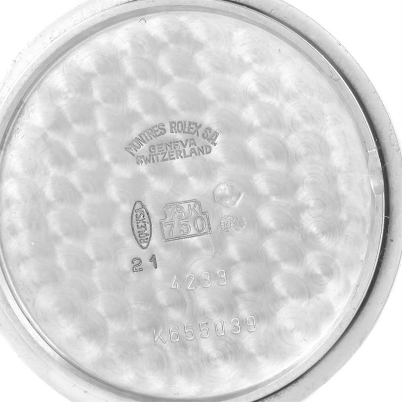 This image shows the interior case back of a Rolex Cellini 4233 Men's White Gold White Dial 4233 Men's White Gold White Dial watch, highlighting engravings and hallmarks.