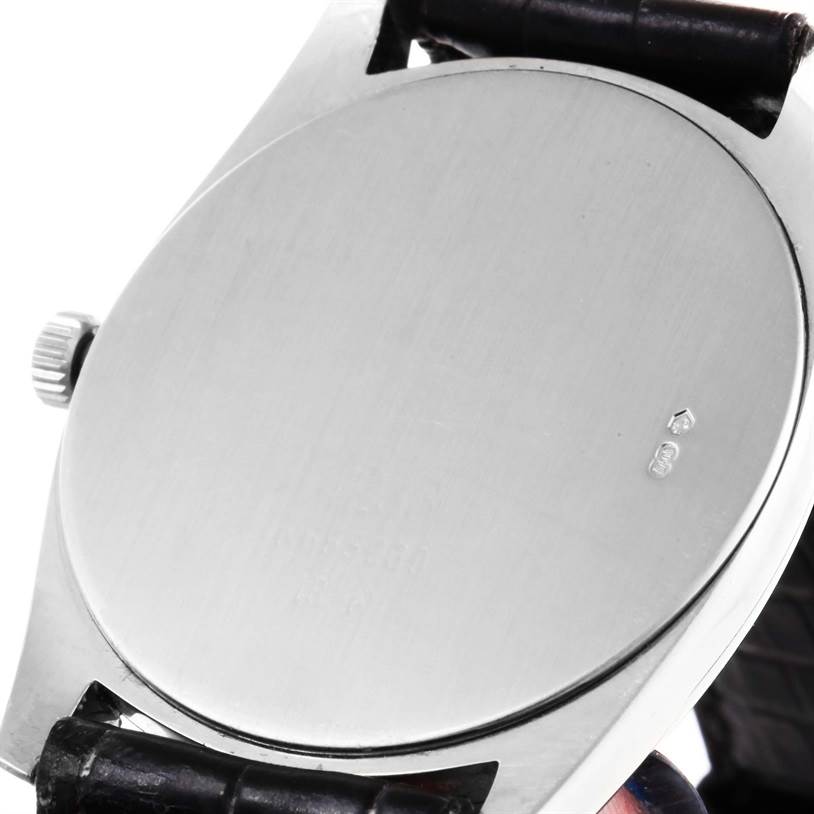 The image shows the back case and part of the crown of a Rolex Cellini 4233 Men's White Gold White Dial 4233 Men's White Gold White Dial watch, with a focus on the stainless steel finish.