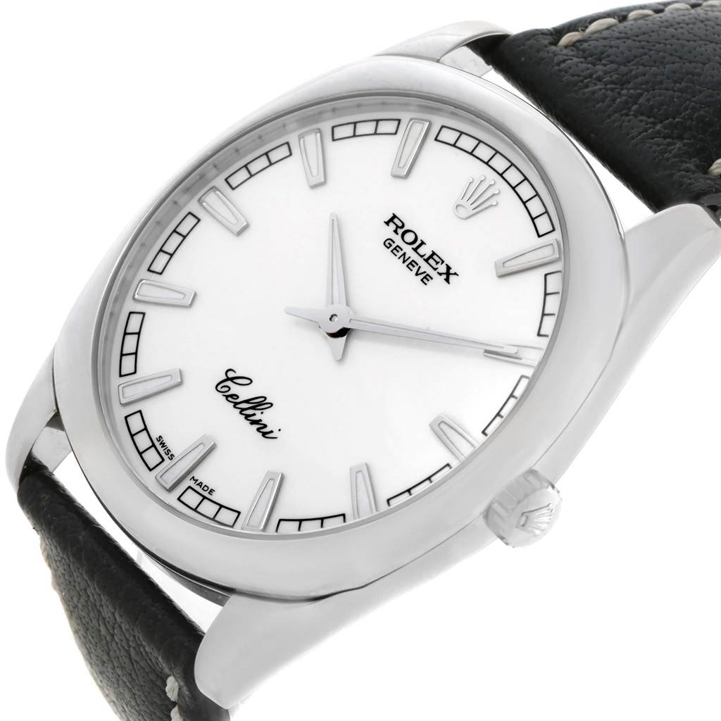 The image shows a close-up angle of a Rolex Cellini 4243 Men's White Gold White Dial 4243 Men's White Gold White Dial watch, highlighting its white dial, hour markers, brand name, and a portion of the leather strap.