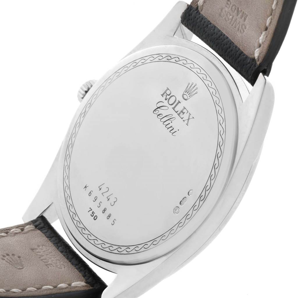 This is a close-up angled view of the back casing of a Rolex Cellini 4243 Men's White Gold White Dial 4243 Men's White Gold White Dial watch, showing the model details and part of the leather strap.