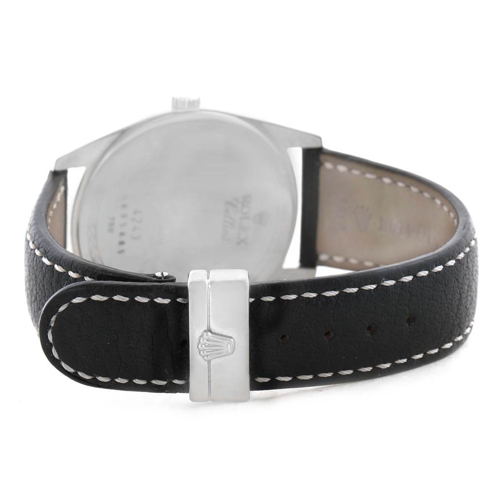 The image shows the back view of a Rolex Cellini 4243 Men's White Gold White Dial 4243 Men's White Gold White Dial watch with a black leather strap and the clasp prominently displayed.