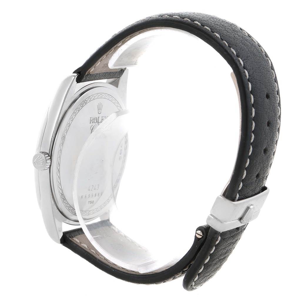 The image shows a side view of the Rolex Cellini 4243 Men's White Gold White Dial 4243 Men's White Gold White Dial model, highlighting the watch case, back, crown, and leather strap with stitching.