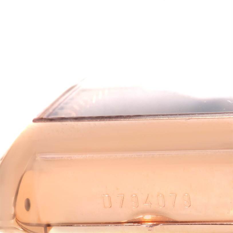 This image shows a close-up of the serial number on a Rolex Cellini 5442 Men's Rose Gold Black Dial 5442 Men's Rose Gold Black Dial model watch, focusing on its side view.