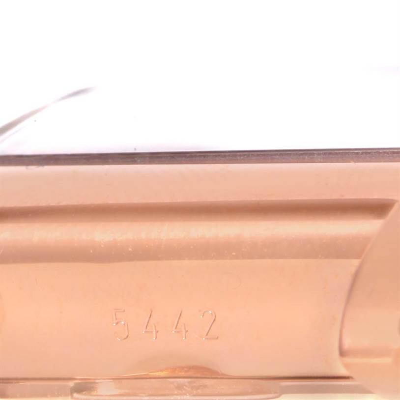 The image shows a close-up of the case side and serial number of a Rolex Cellini 5442 Men's Rose Gold Black Dial 5442 Men's Rose Gold Black Dial watch.