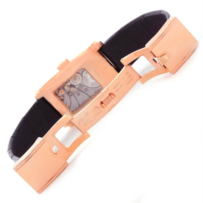 The image shows the open rose gold clasp and back case of a Rolex Cellini 5442 Men's Rose Gold Black Dial 5442 Men's Rose Gold Black Dial watch, revealing part of the movement.