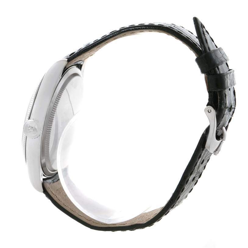 The side view of the Rolex Cellini 50509 Men's White Gold White Dial 50509 Men's White Gold White Dial shows the case, crown, and leather strap.