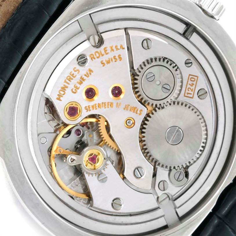 This image shows a close-up of the movement, gears, and internal mechanisms of a Rolex Cellini 5240 Men
s Platinum Mother of Pearl Dial 5240 Men
s Platinum Mother of Pearl Dial watch.