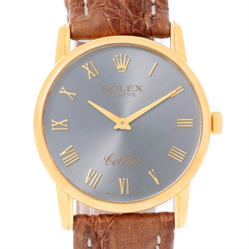 The image shows a front view of the Rolex Cellini 5116 Yellow Gold Grey Dial 5116 Yellow Gold Grey Dial watch, featuring a brown leather strap, gold case, and grey dial with Roman numerals.