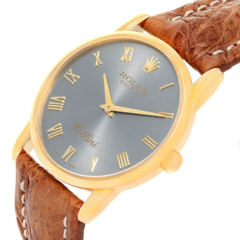 The image shows a Rolex Cellini 5116 Yellow Gold Grey Dial 5116 Yellow Gold Grey Dial watch at an angled view, displaying the face, crown, and part of the strap.