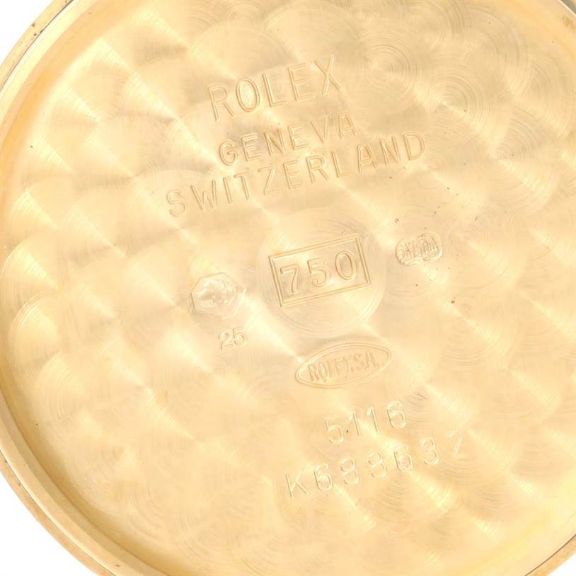 This image shows the inner case back of a Rolex Cellini 5116 Yellow Gold Grey Dial 5116 Yellow Gold Grey Dial watch, featuring engravings and hallmarks.