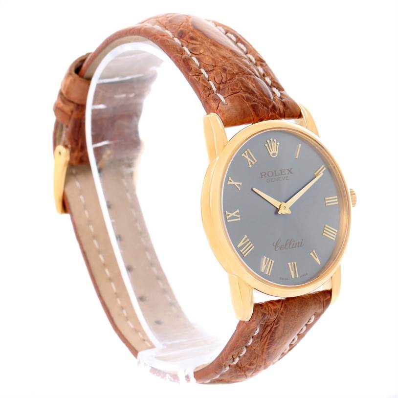 This image shows a Rolex Cellini 5116 Yellow Gold Grey Dial 5116 Yellow Gold Grey Dial watch at a three-quarter angle, highlighting the gray dial, gold case, and brown leather strap.