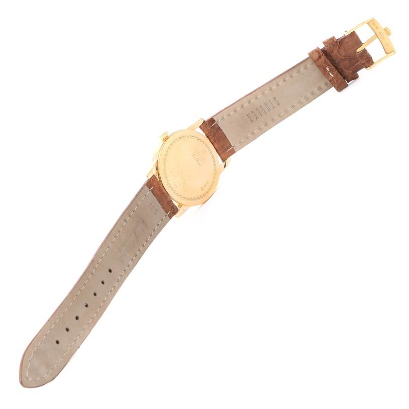 This is a rear view of the Rolex Cellini 5116 Yellow Gold Grey Dial 5116 Yellow Gold Grey Dial watch, showing the back case and both leather straps.