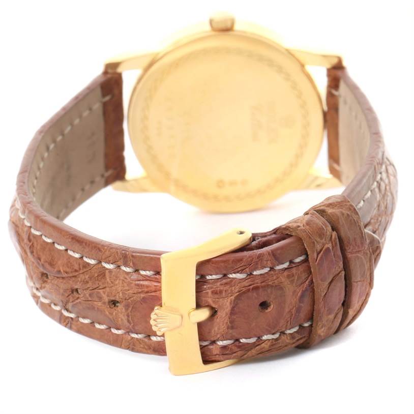 The image shows the back view of a Rolex Cellini 5116 Yellow Gold Grey Dial 5116 Yellow Gold Grey Dial watch, highlighting the strap and buckle.