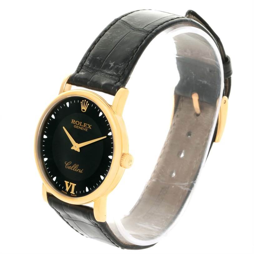 This is a side-angle view of the Rolex Cellini 5115 Yellow Gold Black Dial 5115 Yellow Gold Black Dial watch highlighting the black dial, gold case, and black leather strap.
