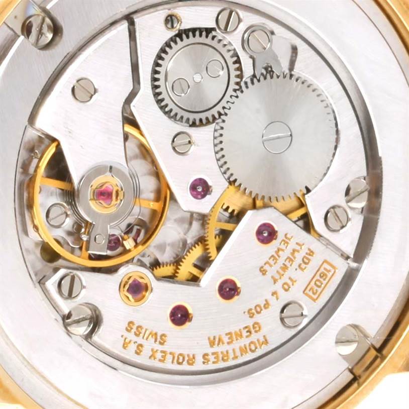 This image shows the intricate inner mechanisms and gears of a Rolex Cellini 5115 Yellow Gold Black Dial 5115 Yellow Gold Black Dial watch
s movement.