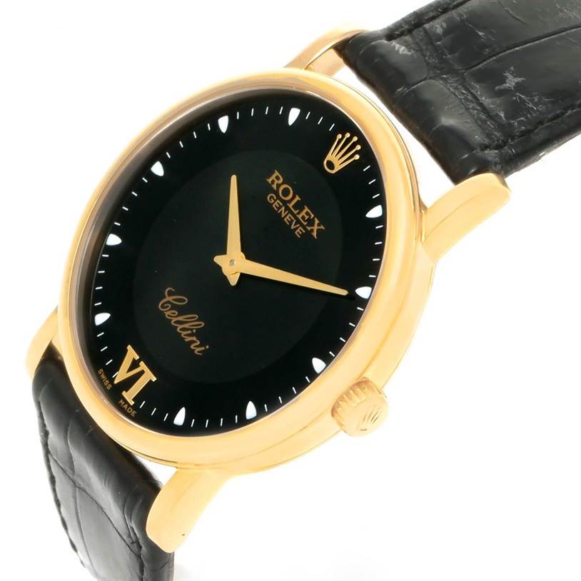 The image shows a Rolex Cellini 5115 Yellow Gold Black Dial 5115 Yellow Gold Black Dial watch at an angle displaying its black dial, gold hands, crown, and leather strap.