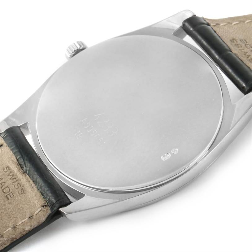 The image shows the back case and partially the strap of a Rolex Cellini 4233 White Gold White Dial 4233 White Gold White Dial watch from a slightly oblique angle.