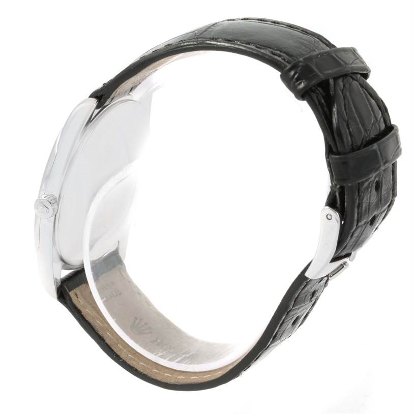 The image shows a side view of a Rolex Cellini 4233 White Gold White Dial 4233 White Gold White Dial watch, highlighting the case, crown, and black leather strap.