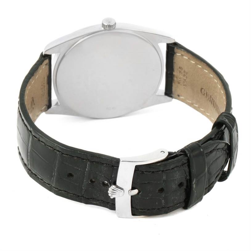 The image shows the back view of a Rolex Cellini 4233 White Gold White Dial 4233 White Gold White Dial watch with its leather strap and metal clasp visible.