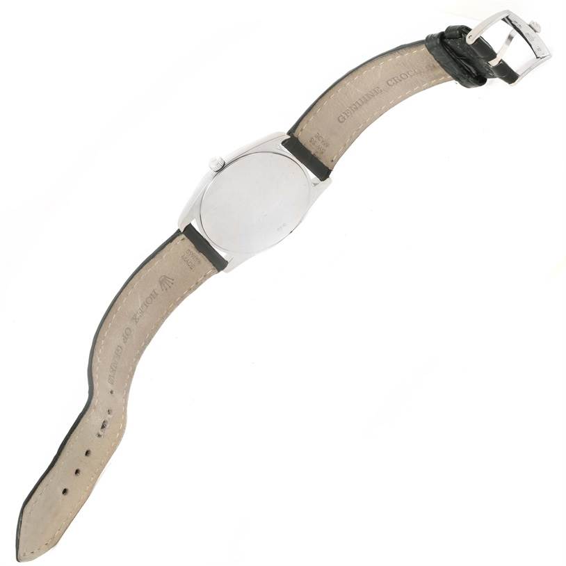 The image shows the back of a Rolex Cellini 4233 White Gold White Dial 4233 White Gold White Dial watch at a slight angle and includes its leather strap and buckle.