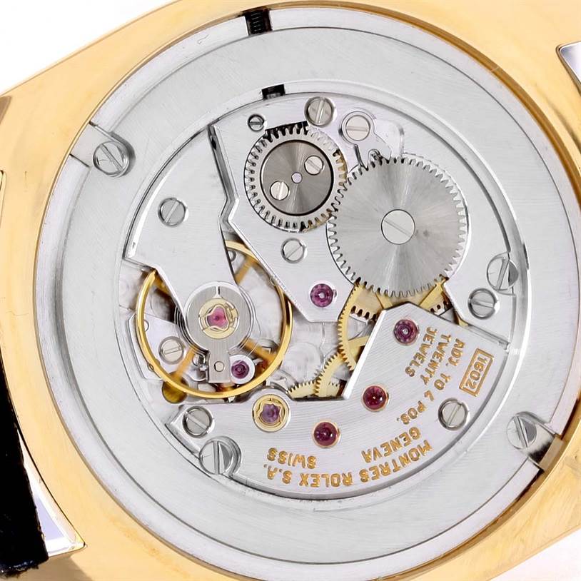 This image shows the back of the Rolex Cellini 4233 Yellow Gold White Dial 4233 Yellow Gold White Dial watch, revealing the intricate inner mechanical movement.