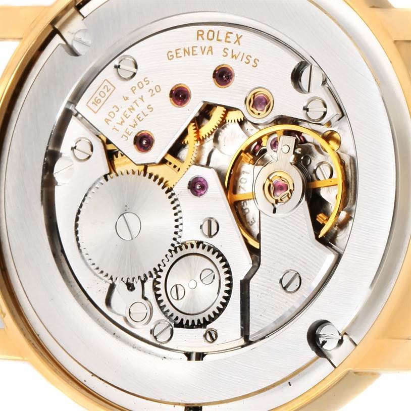 The image shows the intricate internal mechanics of a Rolex Cellini 5115 Men's Yellow Gold Champagne Dial 5115 Men's Yellow Gold Champagne Dial watch from a rear angle.