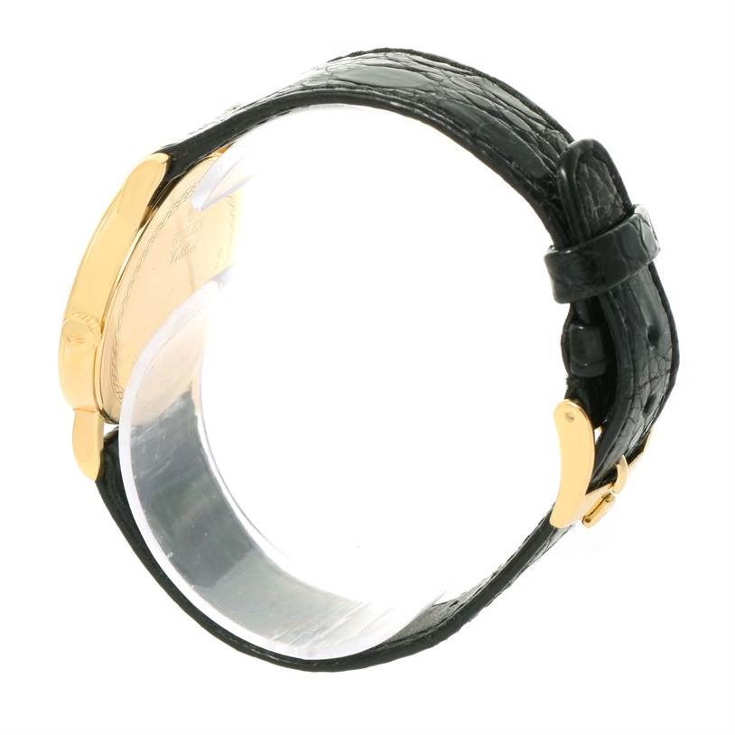 The image displays a side view of the Rolex Cellini 5115 Men's Yellow Gold Champagne Dial 5115 Men's Yellow Gold Champagne Dial watch, highlighting its black leather strap and gold-tone case.