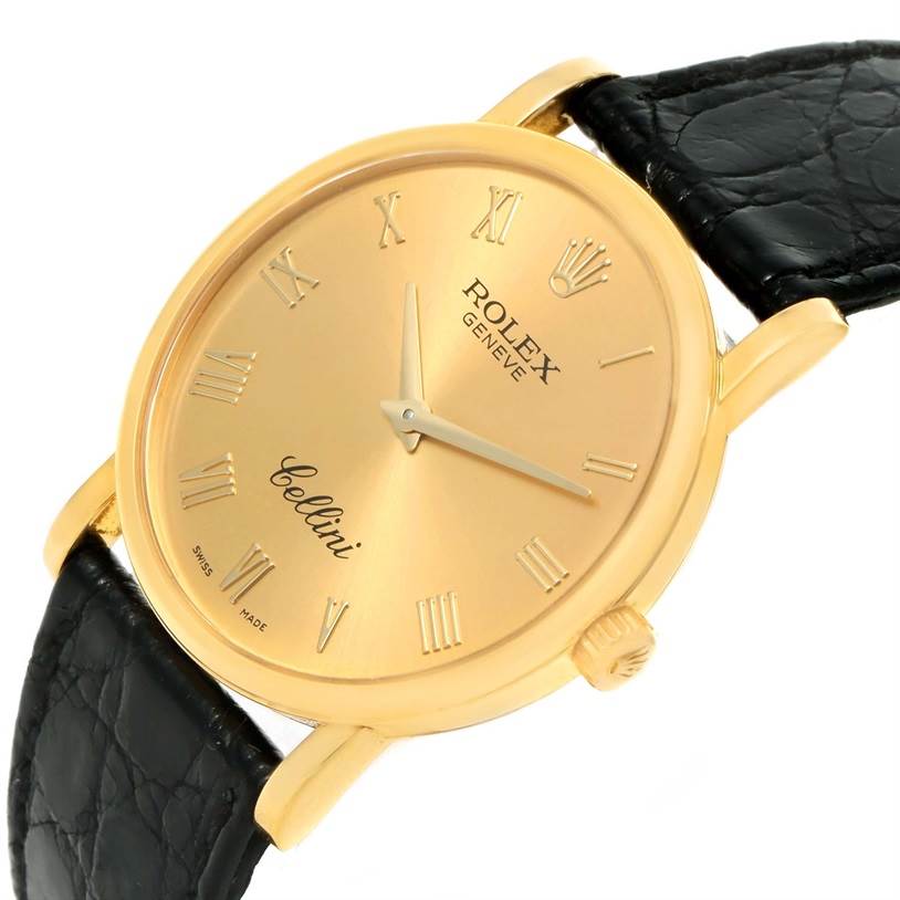This image shows a close-up angle of the Rolex Cellini 5115 Men's Yellow Gold Champagne Dial 5115 Men's Yellow Gold Champagne Dial watch, highlighting its gold dial, Roman numerals, and black leather strap.