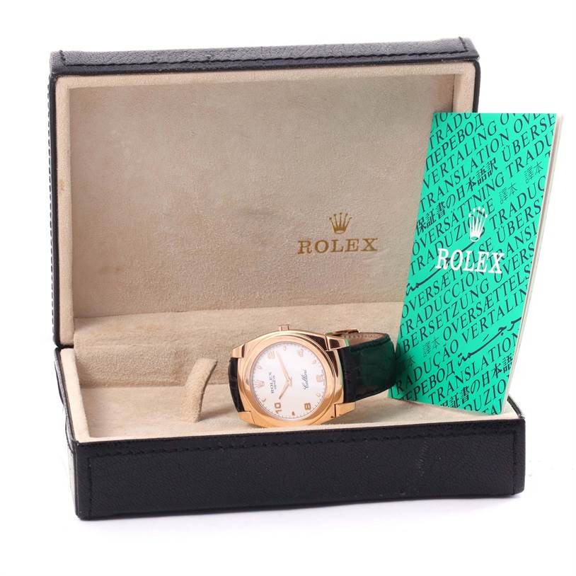 The image shows a Rolex Cellini 5330 Rose Gold White Dial 5330 Rose Gold White Dial watch placed at an angle inside its case with the instruction manual next to it.