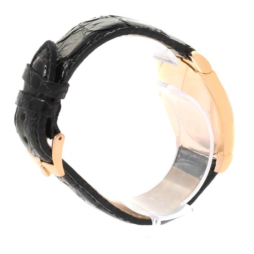 The image shows the side view of a Rolex Cellini 5330 Rose Gold White Dial 5330 Rose Gold White Dial watch, highlighting its black leather strap and a portion of the rose gold case.