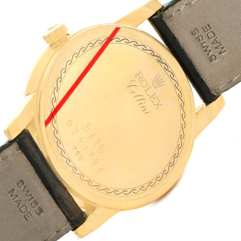 This image shows the back case and part of the strap of a Rolex Cellini 5116 Men's Yellow Gold Beige Dial 5116 Men's Yellow Gold Beige Dial watch at an angled view.