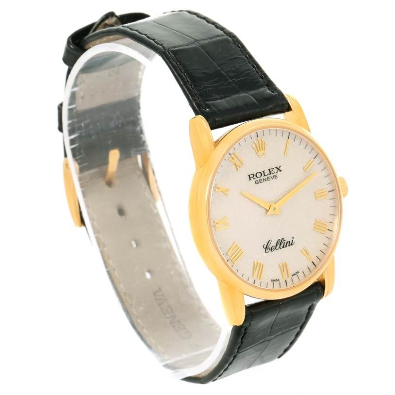 This image shows a Rolex Cellini 5116 Men's Yellow Gold Beige Dial 5116 Men's Yellow Gold Beige Dial watch at a three-quarter angle, highlighting the watch face, gold case, and black leather strap.