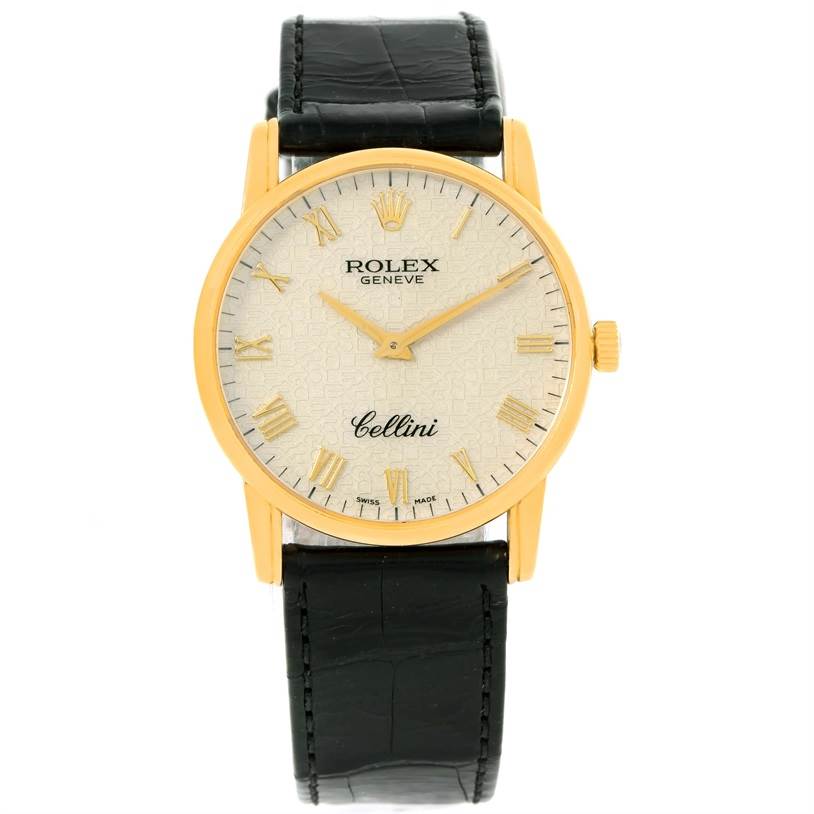 This Rolex Cellini 5116 Men's Yellow Gold Beige Dial 5116 Men's Yellow Gold Beige Dial watch is shown in a front-facing angle, revealing its dial, gold case, crown, and black leather strap.