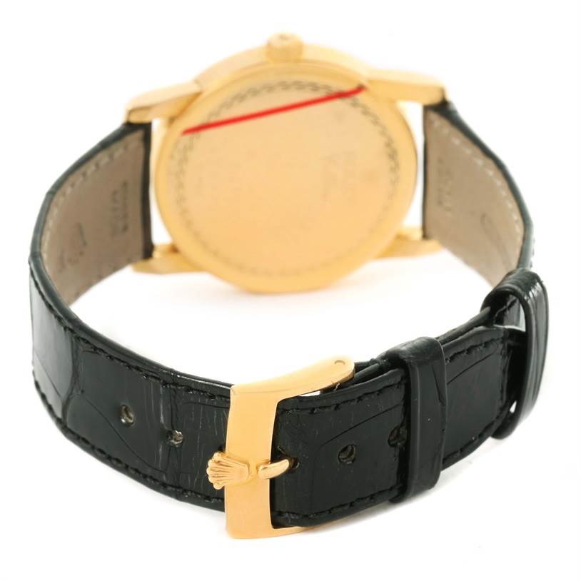 The image shows the back view of a Rolex Cellini 5116 Men's Yellow Gold Beige Dial 5116 Men's Yellow Gold Beige Dial watch, highlighting its strap and buckle.