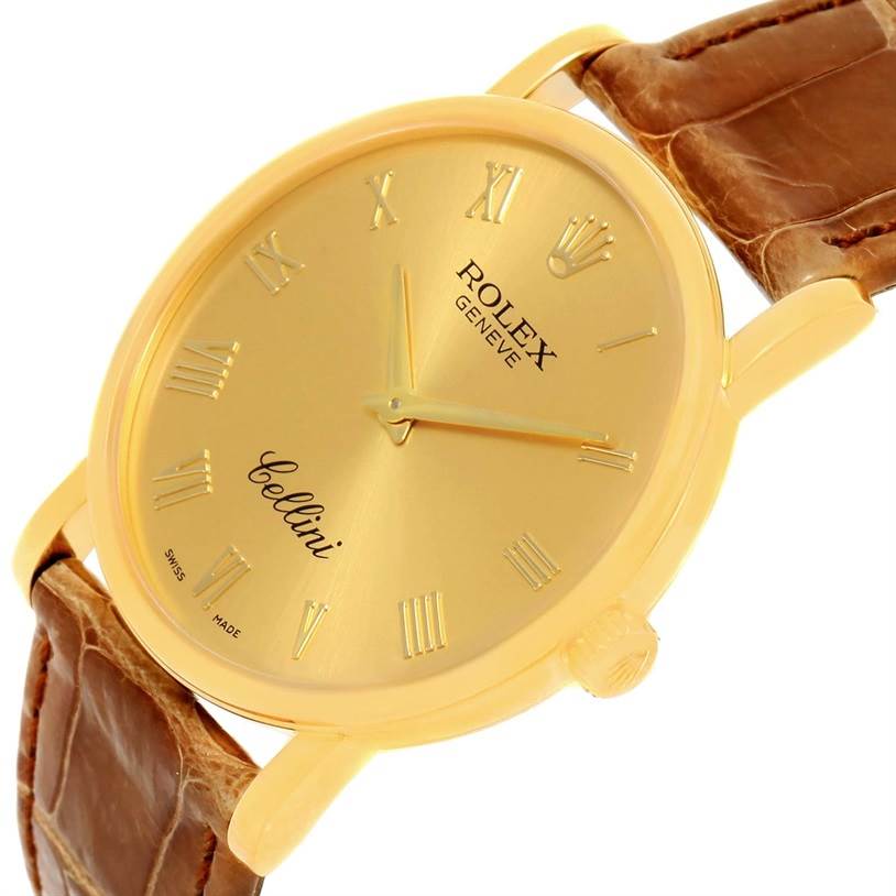 This image shows a close-up angle of the Rolex Cellini 5115 Men
s Yellow Gold Champagne Dial 5115 Men
s Yellow Gold Champagne Dial watch, highlighting its gold dial, hands, Roman numerals, and leather strap.