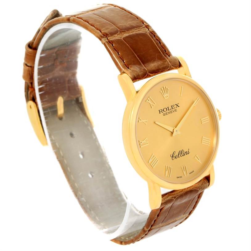 The angled image shows the Rolex Cellini 5115 Men
s Yellow Gold Champagne Dial 5115 Men
s Yellow Gold Champagne Dial watch with a clear view of the casing, dial, and brown leather strap.