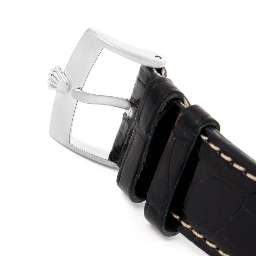 The image shows a close-up of the black leather strap and clasp of a Rolex Cellini 4233 Men
s White Gold Black Dial 4233 Men
s White Gold Black Dial watch.