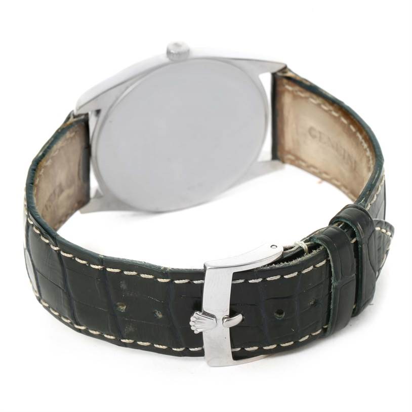 The image shows the back view of a Rolex Cellini 4233 Men
s White Gold Black Dial 4233 Men
s White Gold Black Dial watch, highlighting the clasp and leather strap.