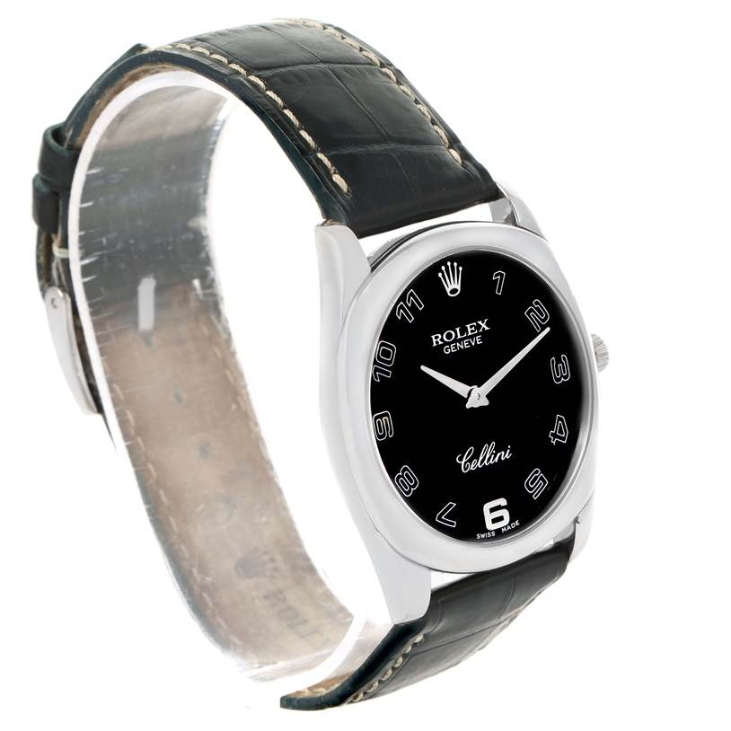 The image shows a Rolex Cellini 4233 Men
s White Gold Black Dial 4233 Men
s White Gold Black Dial watch at a three-quarter angle, displaying the black dial, leather strap, and part of the clasp.
