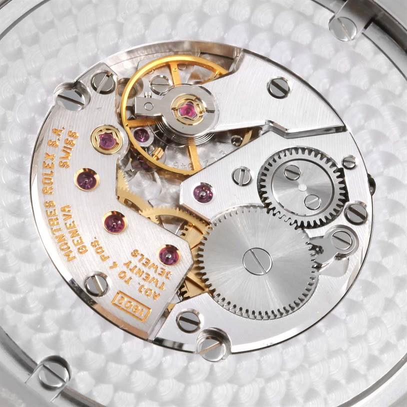 This image shows a close-up view of the internal movement mechanism of a Rolex Cellini 4243 Men
s White Gold Black Dial 4243 Men
s White Gold Black Dial watch.