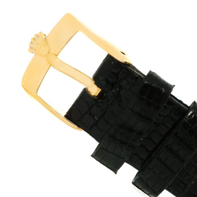 This image shows a close-up of the strap and gold buckle of a Rolex Cellini 5112 Men's Yellow Gold Champagne Dial 5112 Men's Yellow Gold Champagne Dial watch.